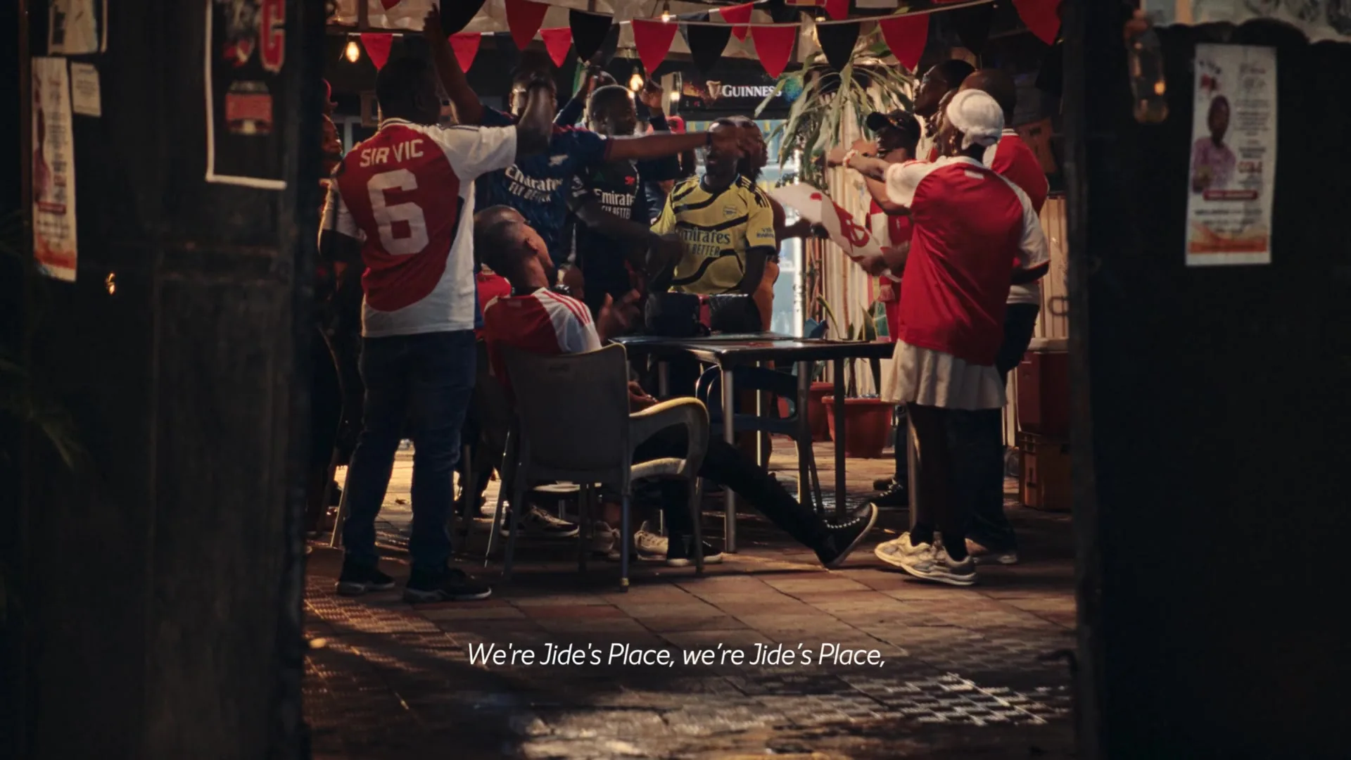 Guinness × Arsenal — fans watching at Jide's Place, Lagos